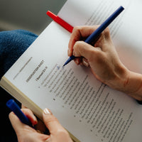 Person marking scripture passage
